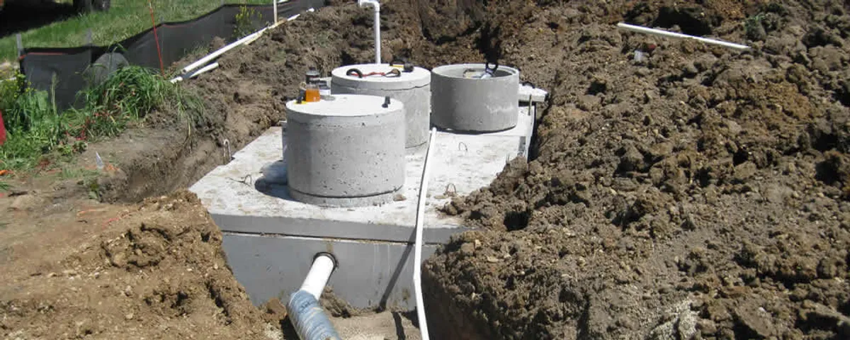 Septic system repair and installation site with tank access ports in Sarasota, FL